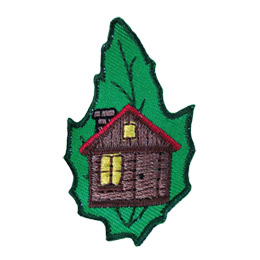 A cabin with a lit window is on a green leaf.