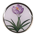 A flower pin with a painted design. 