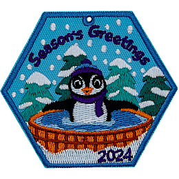 A penguin lounging in the hot tub under the words Season's Greetings.