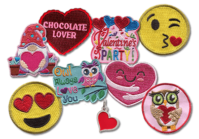 A variety of Valentine's Day themed patches and a heart charm are displayed.